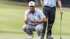 Sebastian Munoz lining up a putt at LIV Golf Hong Kong