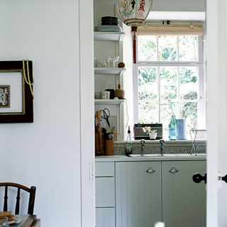 Kitchen with white walls and white cabinet