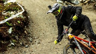 A mountain biker wearing a pair of the MTB gloves