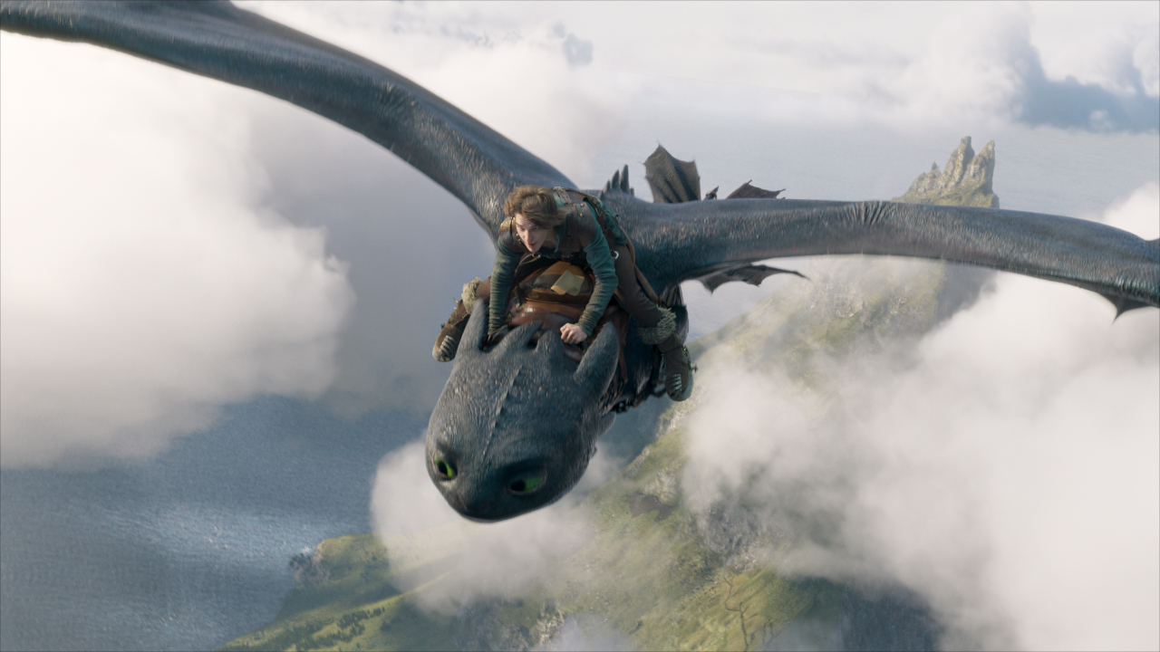 Mason Thames flies through the sky on Toothless in How To Train Your Dragon (2025). 