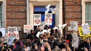 Doves are released outside Tottenham Police Station