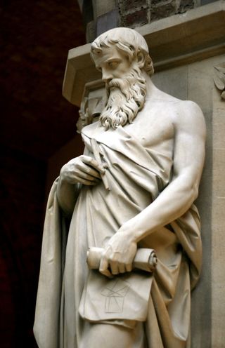 A statue of Euclid with something very interesting added to his scroll.