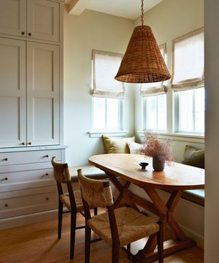 eat in kitchen with cream walls and custom banquette seating