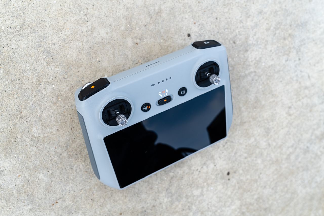 The DJI Mini 3 Pro drone resting on the ground