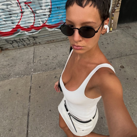 An image of a woman wearing timeless summer outfit