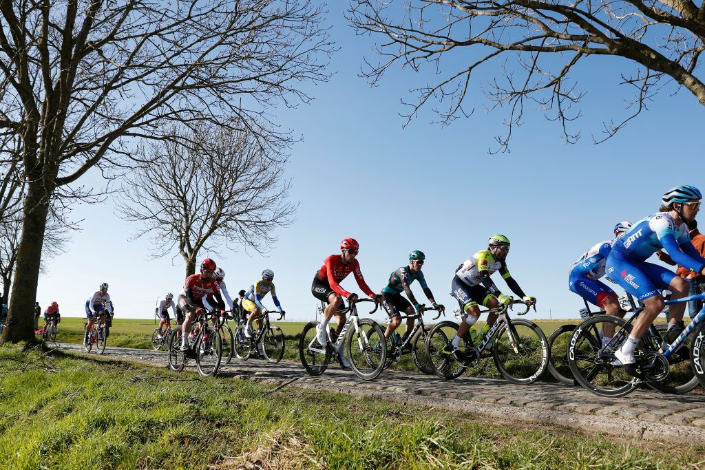 NINOVE BELGIUM FEBRUARY 26 Kevin Vauquelin of France and Team Arka Samsic Andrea Pasqualon of Italy and Team Intermarch Wanty Gobert Matriaux and The Peloton compete during the 77th Omloop Het Nieuwsblad 2022 Mens Race a 2042km race from Ghent to Ninove OHN22 FlandersClassic WorldTour on February 26 2022 in Ninove Belgium Photo by Bas CzerwinskiGetty Images