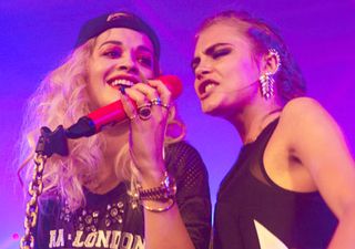 Rita Ora and Cara Delevingne perform on stage together