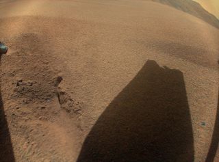 A shadow of a broken helicopter rotor on Mars