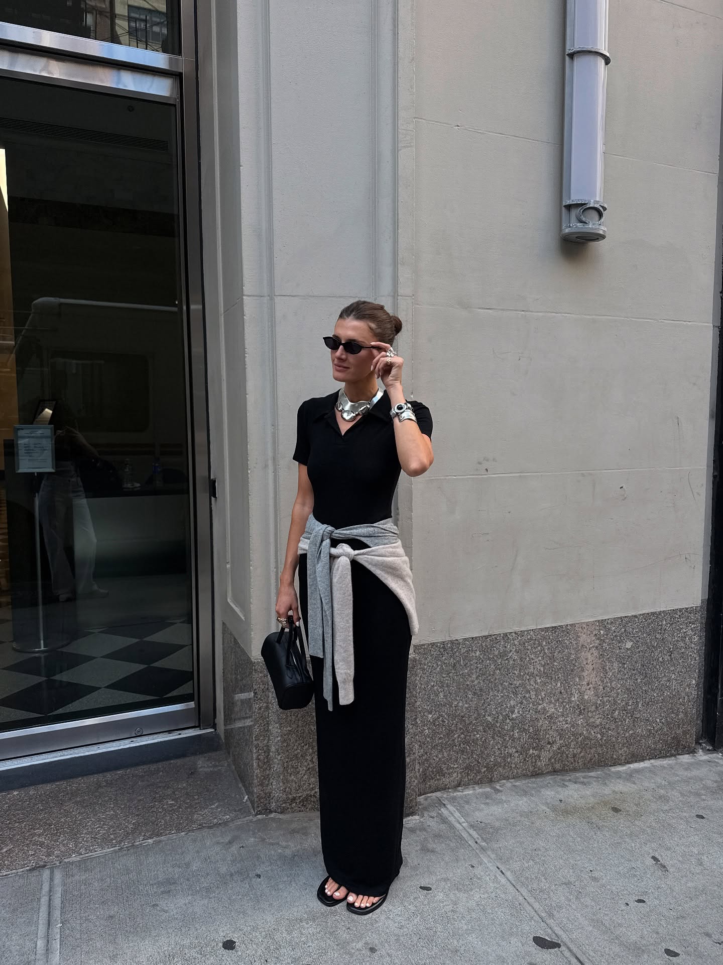 Woman wearing a summer 2026 jewelry trend.