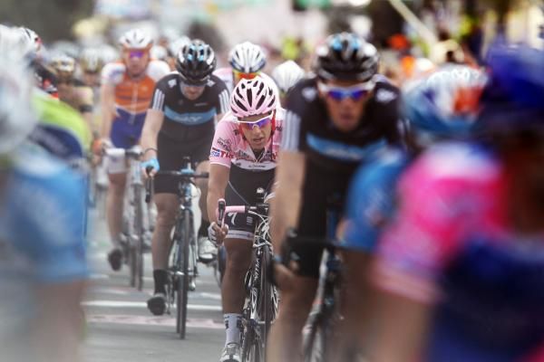 Richie Porte in the midst of the peloton as they cross the finish