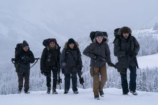 danny ramirez, tati gabrielle, ariela barer, kaitlyn dever and spencer lord walking up a hill covered in snow in the last of us season 2