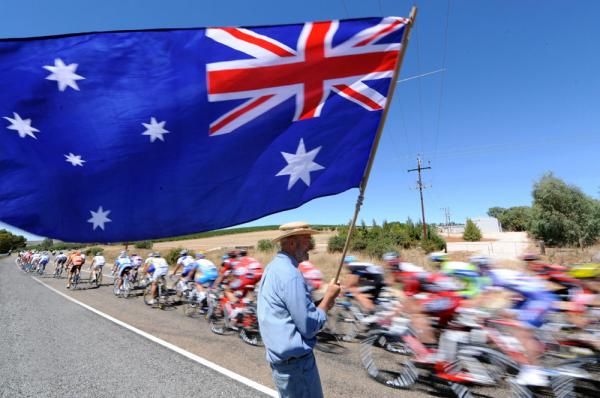 A spectator reminds the peloton where they are