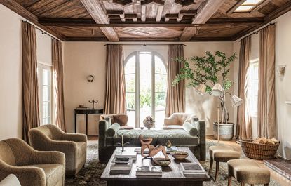 grand living room with daybed and indoor tree