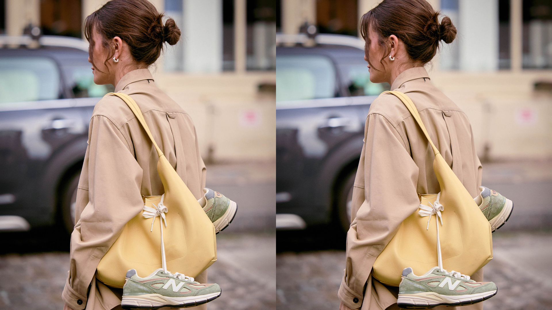 Woman wears tan button down while carrying a large yellow handbag with green New Balance sneakers hanging off of the handbag. 