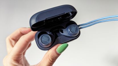 JBL Reflect Aero review: man working out with true wireless earbuds in