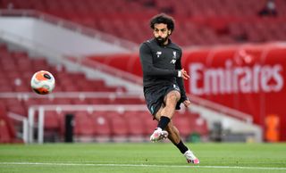 Liverpool’s Mohamed Salah during the warm up before the Premier League match at the Emirates Stadium, London