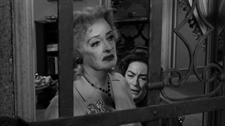 Bette Davis and Joan Crawford at window in What Ever Happened To Baby Jane?