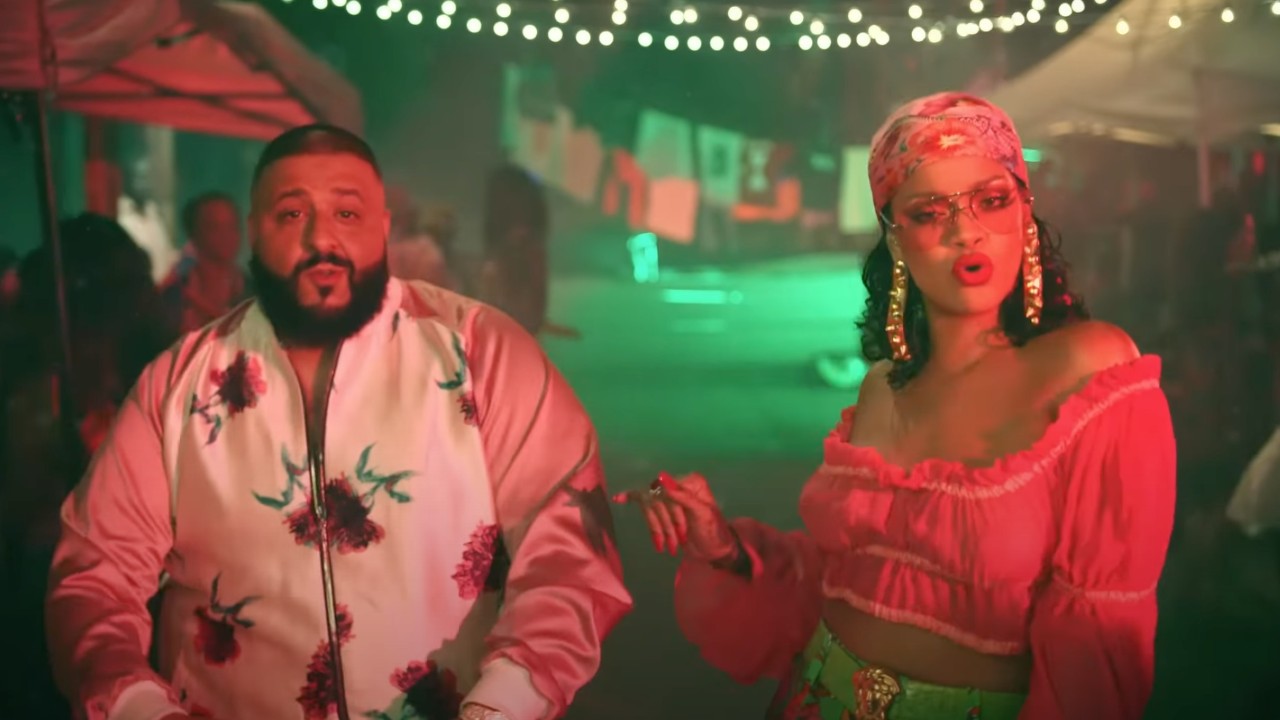 DJ Khaled and Rihanna walking down the street in the Wild Thoughts video. 
