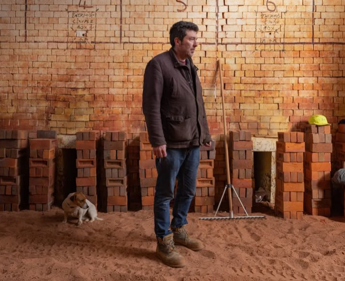 Photo of Jim Matthews in an oil kiln