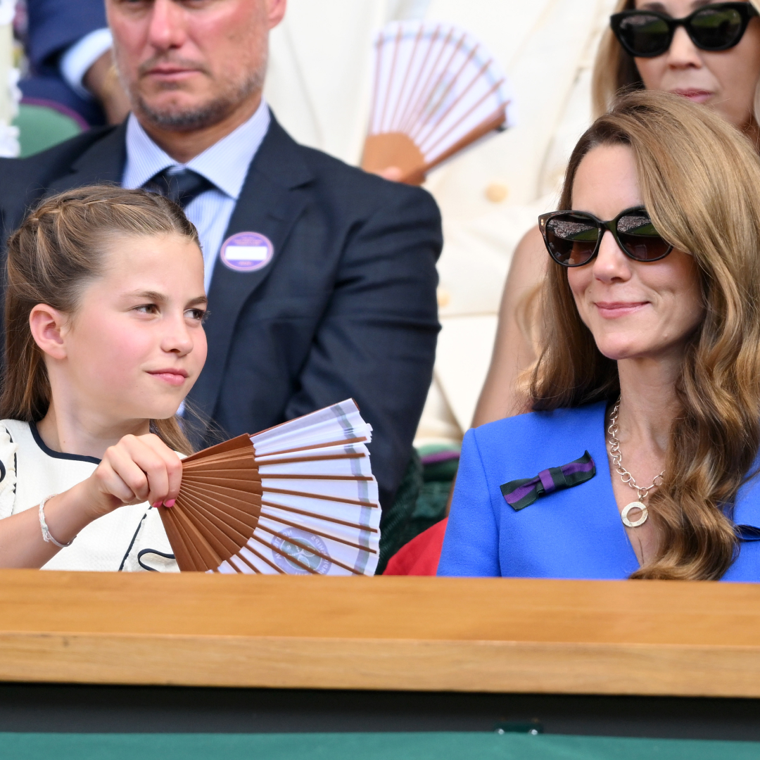 Princess Charlotte fans her mom Kate Middleton at Wimbledon as they watch the tennis tournament during a heat wave