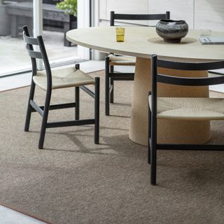 Alternative Flooring Anywhere Panama Copper Rug with a Whipped Edge in a dining room