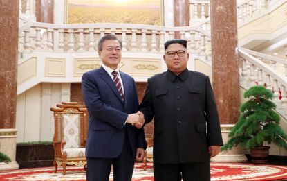 Moon Jae-in and Kim Jong Un.