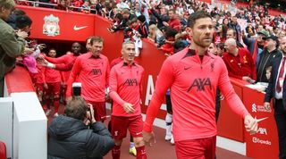 Xabi Alonso leads out Liverpool's legends for a game against Manchester United at Anfield.