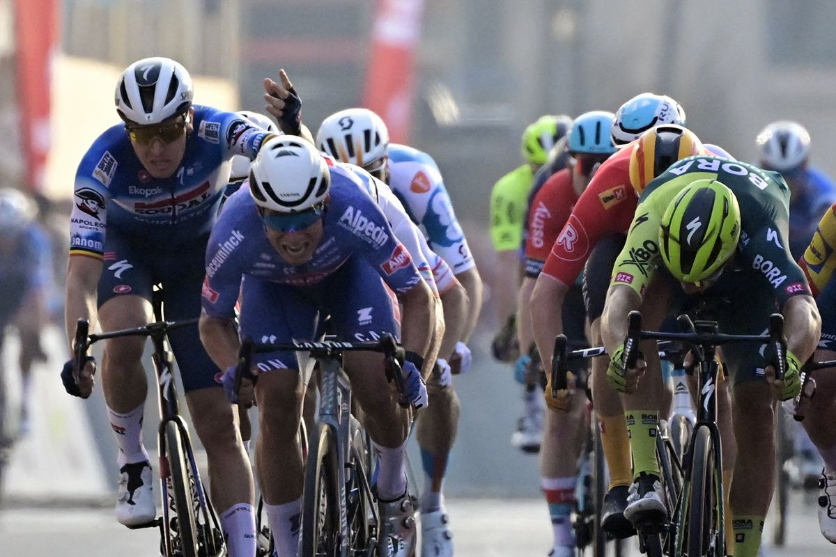 Belgian Jasper De Buyst of Lotto Dstny, Belgian Tim Merlier of Soudal Quick-Step and Dutch Danny van Poppel of Bora-Hansgrohe sprint to the finish of the &#039;Classic Brugge-De Panne&#039; men&#039;s elite one-day cycling race, 198,9 km from Brugge to De Panne, Wednesday 20 March 2024. BELGA PHOTO DIRK WAEM (Photo by DIRK WAEM / BELGA MAG / Belga via AFP) (Photo by DIRK WAEM/BELGA MAG/AFP via Getty Images)