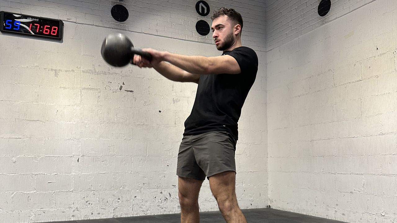 Jordan Shelley doing first stage of Russian kettlebell swing
