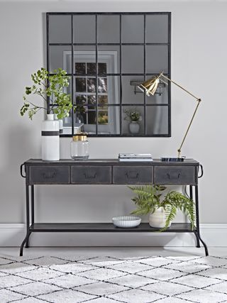 Cox & Cox industrial iron console table with mirror and plant life