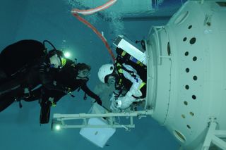 ESA astronaut Samantha Cristoforetti, from Italy, undergoes EVA pre-familiarisation training at ESA's Neutral Buoyancy Facility at the Astronaut Center, in Cologne, Germany, June 9, 2010.