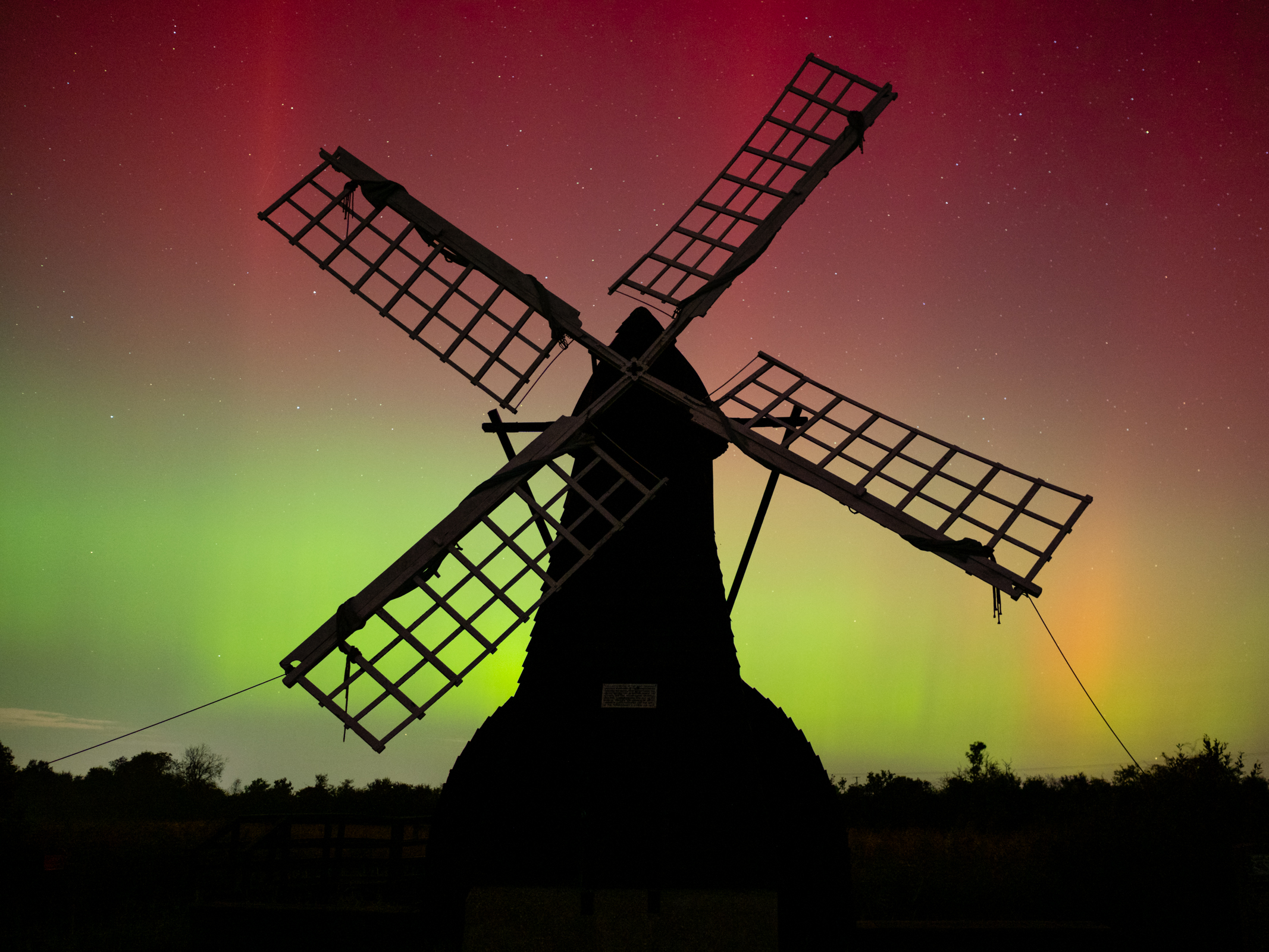 A windpump with the Northern Lights behind shot on a Panasonic Leica Summilux DG 15mm f/1.7 ASPH