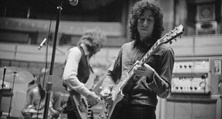 A black-and-white image of Peter Green playing a Gibson Les Paul Standard with Fleetwood Mac