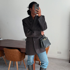 woman wearing fall blazer with jeans outfit 2025