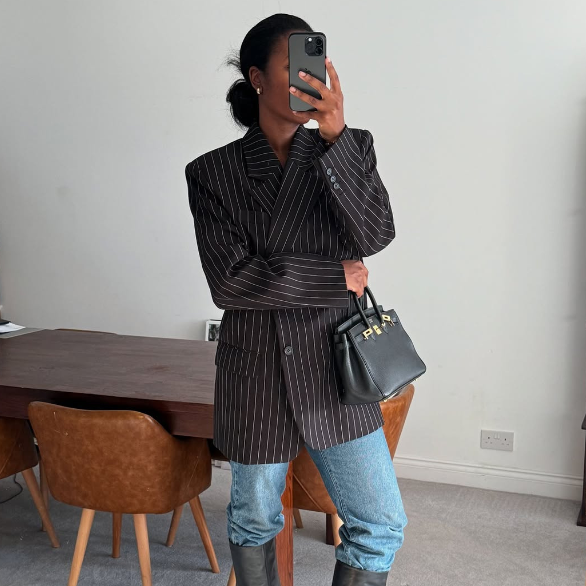 woman wearing fall blazer with jeans outfit 2025