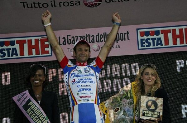 Michele Scarponi celebrates on the podium after winning stage 18.