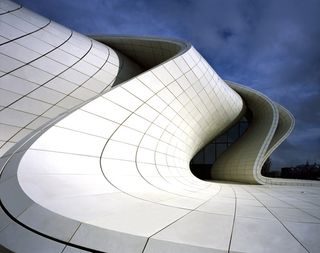 A section of the exterior of the building, showcasing the curved roof