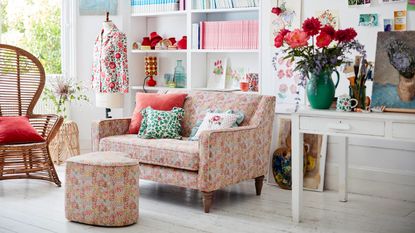 Floral snuggler sofa in white living room