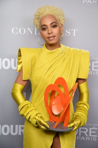 solange knowles with short hair cut in a pixie cut.