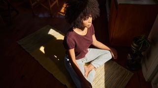 woman meditating in low light