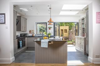 modern grey kitchen with island in modern extension