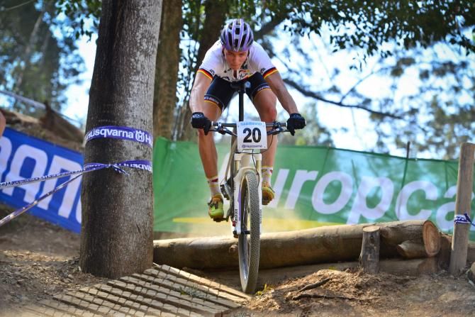 Lukas Baum (Germany) charges to victory in the Junior Men's Cross Country