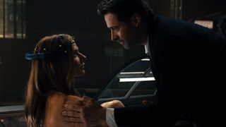 Hugh Jackman helps Rebecca Ferguson in the memory machine in Reminiscence