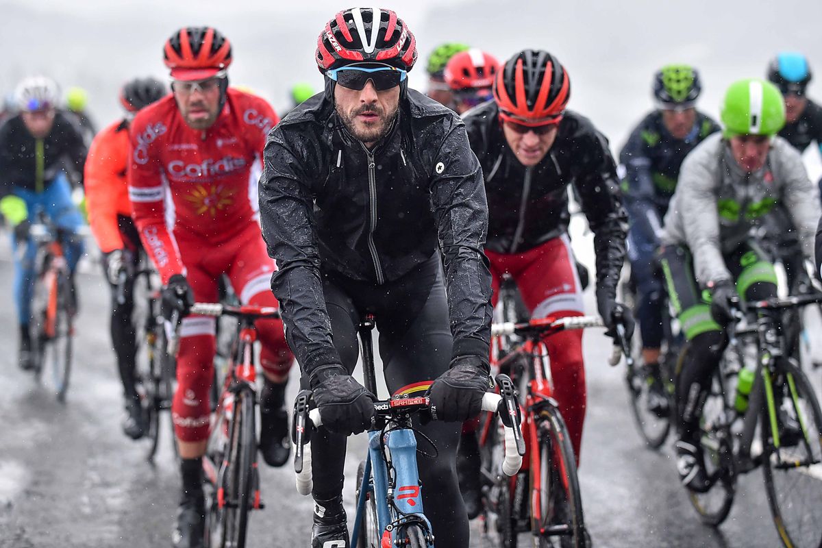 Jelle Vanendert bundled up against the icy, wet conditions