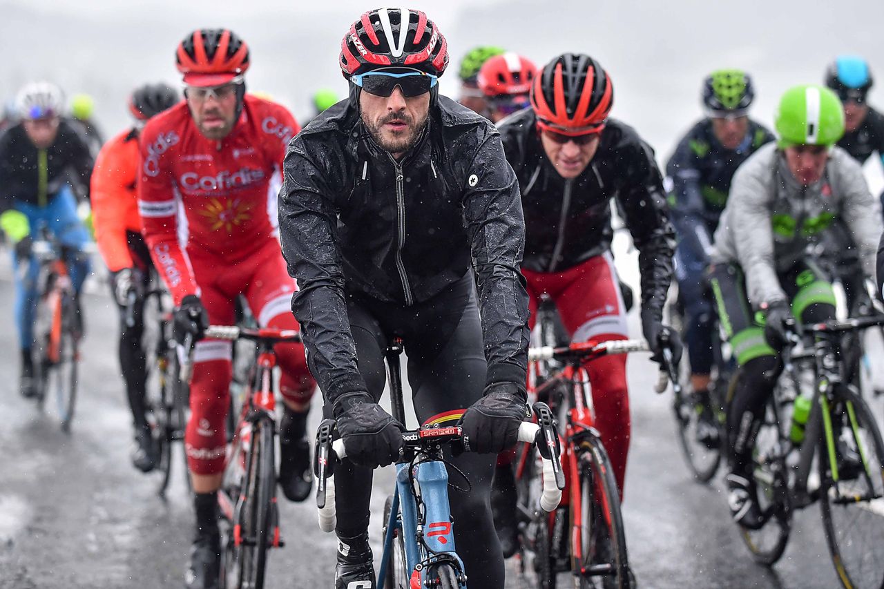 Jelle Vanendert bundled up against the icy, wet conditions