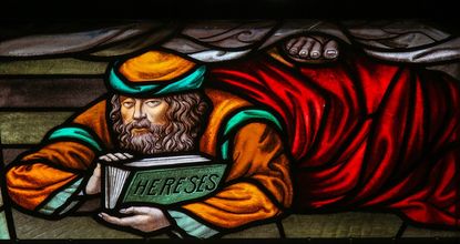 Stained Glass window depicting a heretic, in the Cathedral of Saint Rumbold in Mechelen, Belgium.