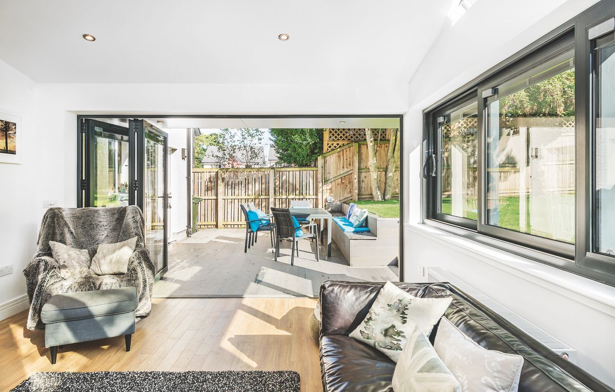 view from living room towards patio with garden dining furniture