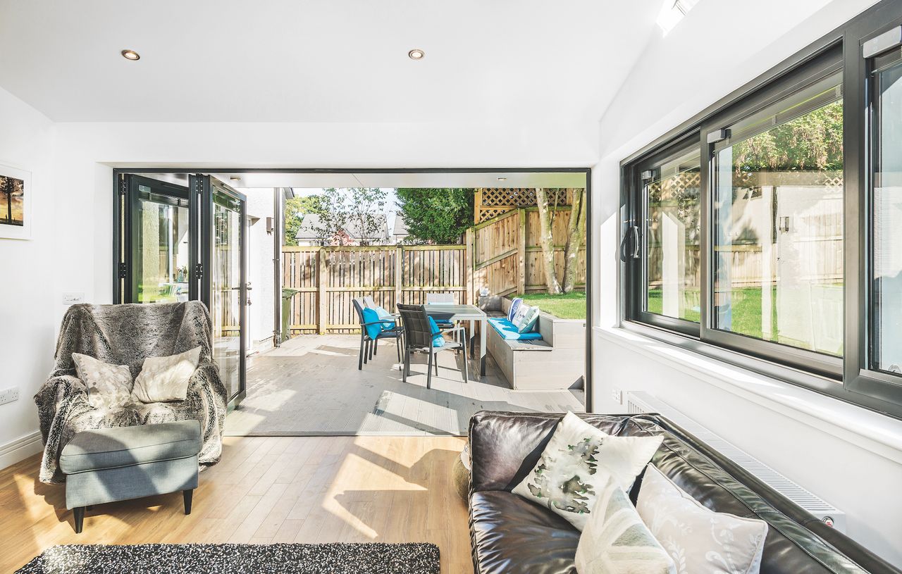 view from living room towards patio with garden dining furniture