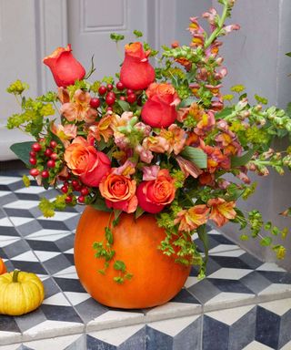 bouquet in carved pumpkin vase from Bloom & Wild