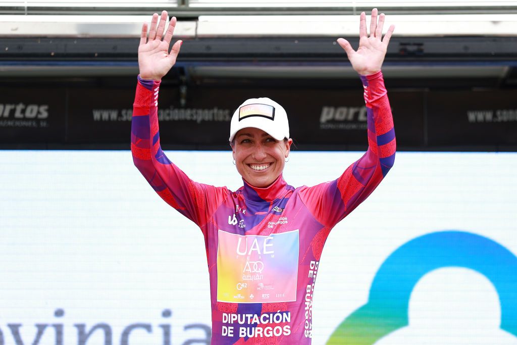 OJO GUARENA SPAIN MAY 21 Margarita Victoria Garcia Caellas of Spain and UAE Team Adq celebrates at podium as Pink Leader Jersey winner after the 7th Vuelta a Burgos Feminas 2022 Stage 3 a 1134km stage from Medina de Pomar to Monumento Natural de Ojo Guarea 767m VueltaBurgos BurgosFem UCIWWT on May 21 2022 in Ojo Guarea Spain Photo by Gonzalo Arroyo MorenoGetty Images